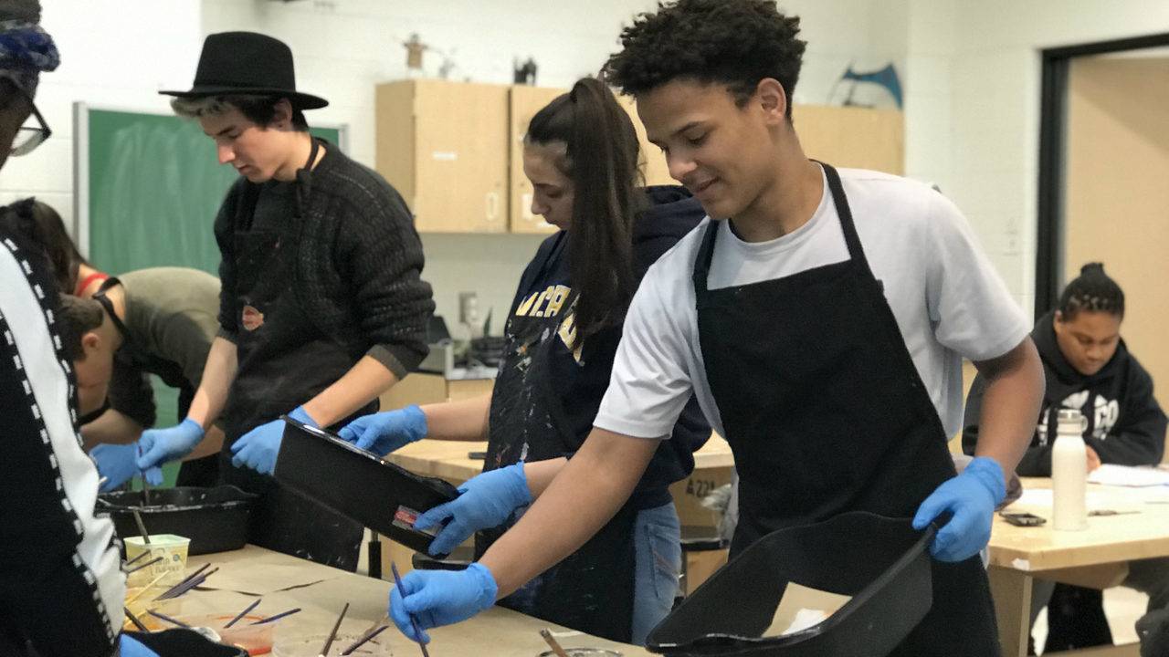 Students at Ann Arbor's Skyline High School create flags to hang downtown for Youth Art Month
