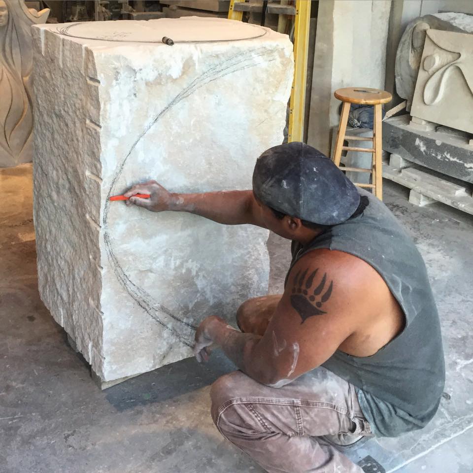 Jason working on a stone piece.