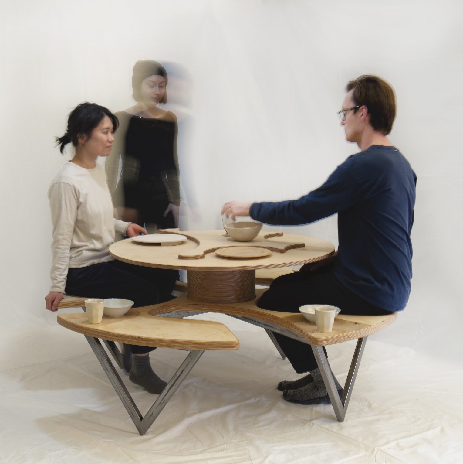 Artwork titled "Swivel Table" with people